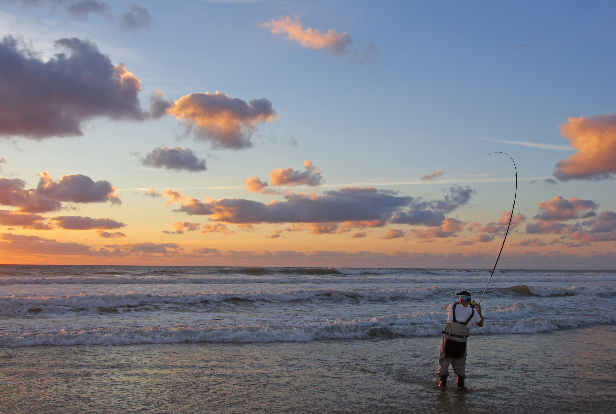 Man fishing on the shoreline